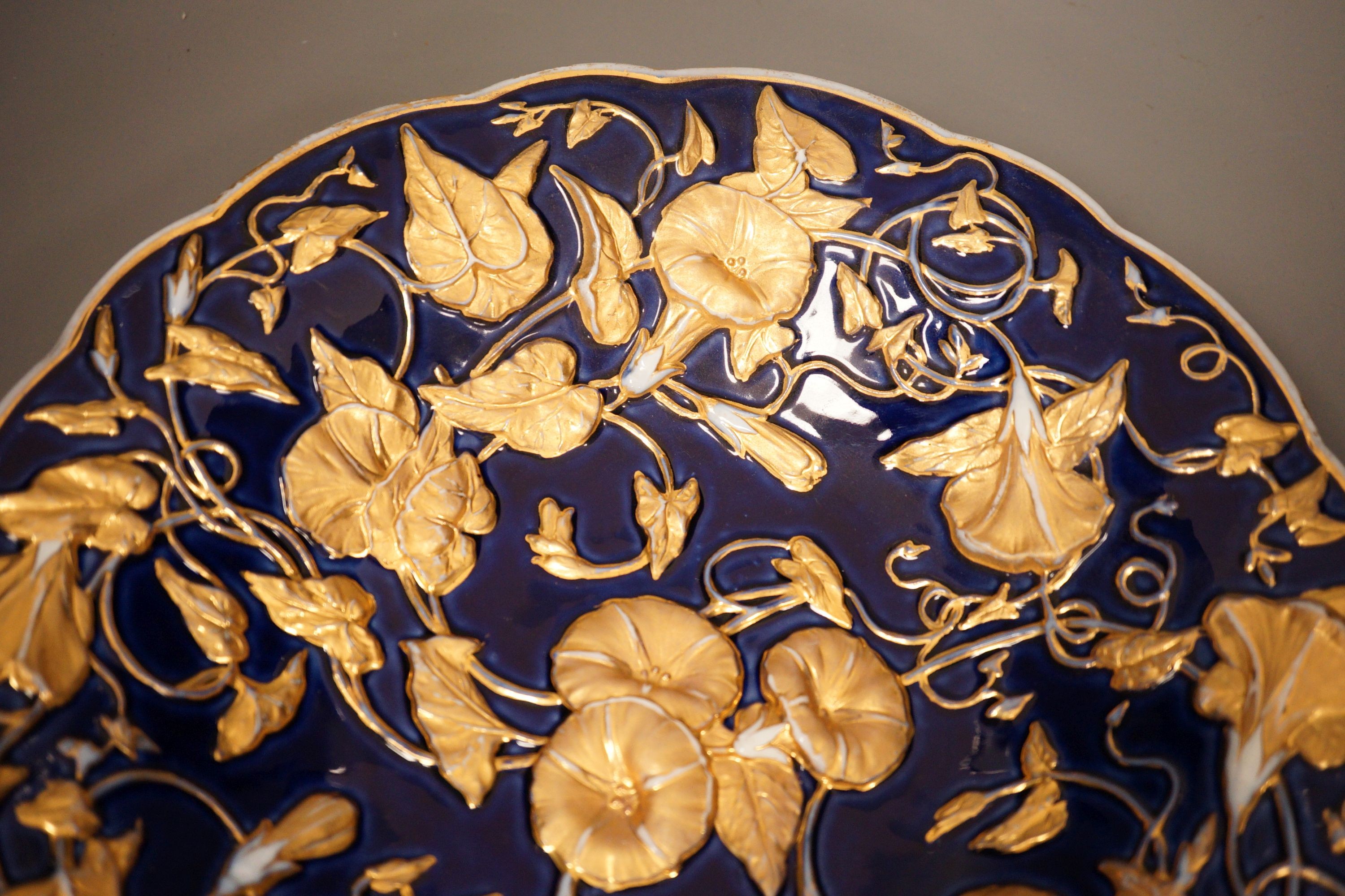A late 19th century Meissen floral gilt and blue dish, 29cm